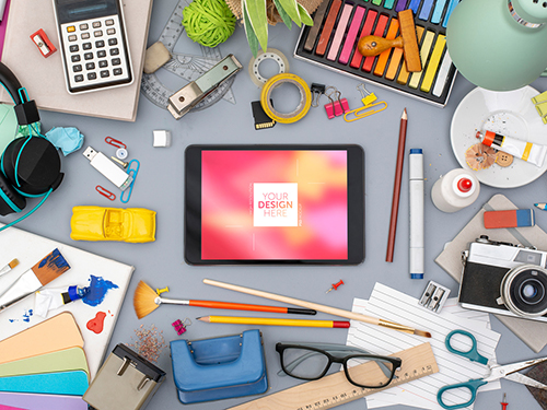 Desk with Tablet and Colorful Art Supplies Mockup 245404736 PSDT