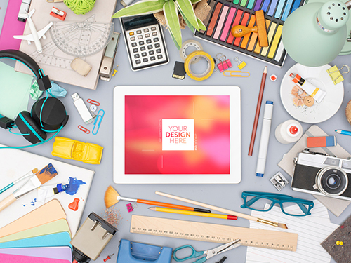 Desk with Tablet and Colorful Art Supplies Mockup 245404447 PSDT